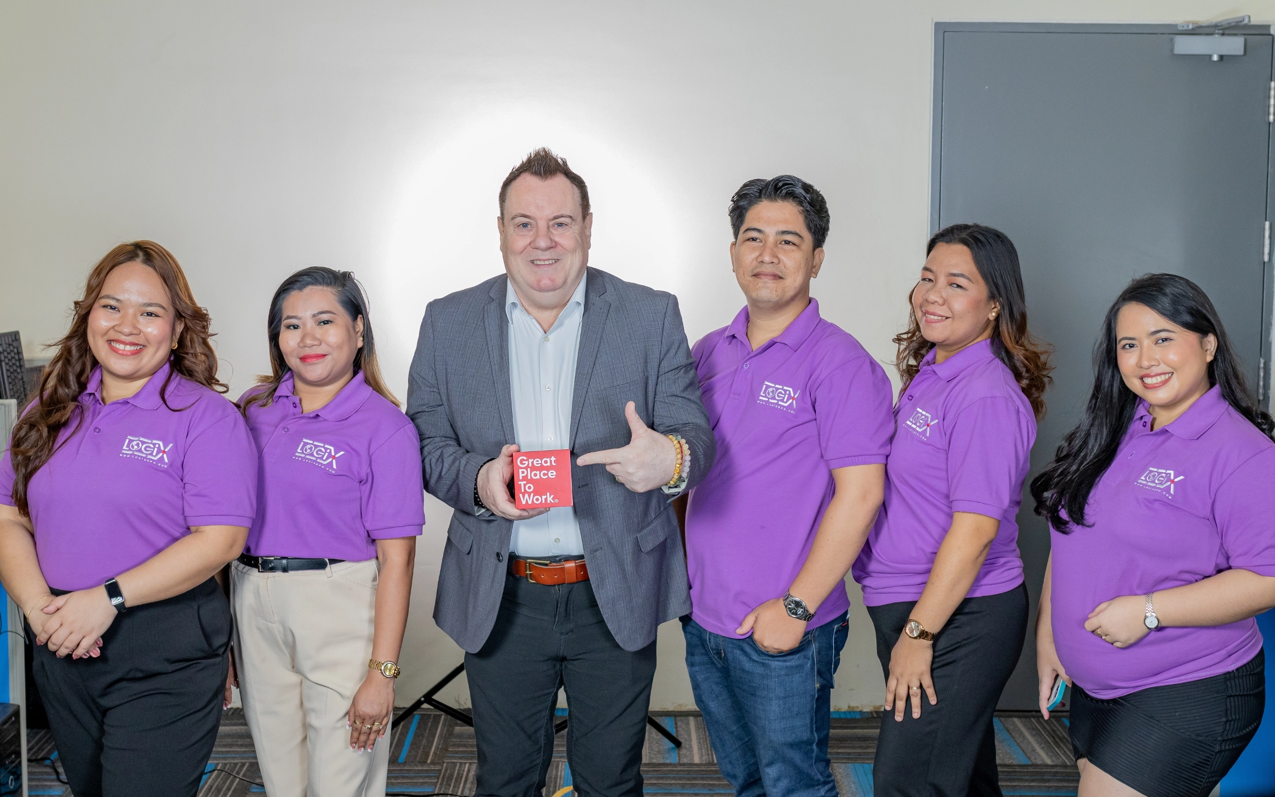 Chris Mackintosh with Logix Employees